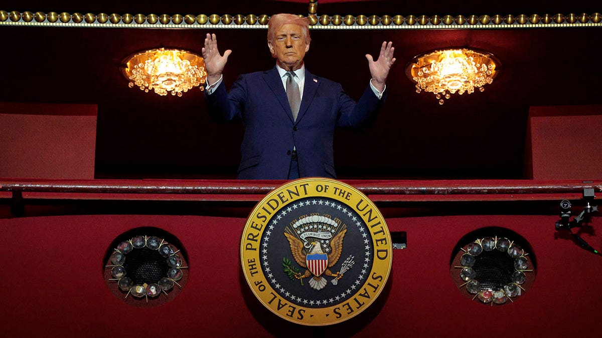 Trump raises hands from box in Kennedy Center