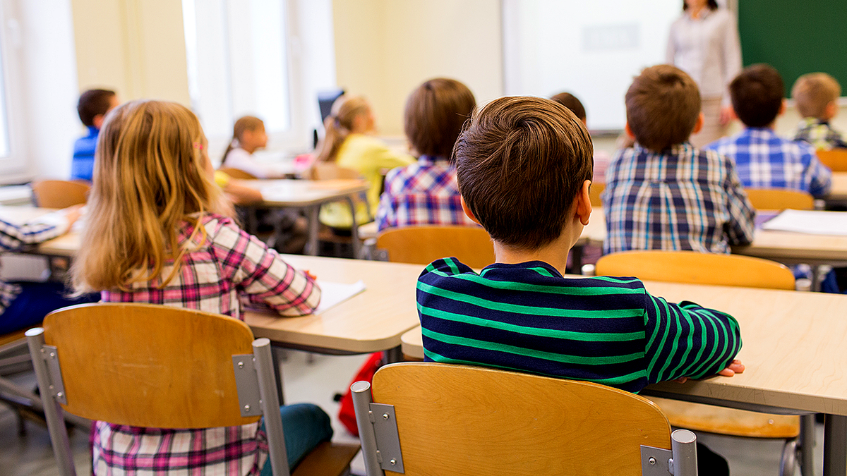Elementary students sitting in classroom