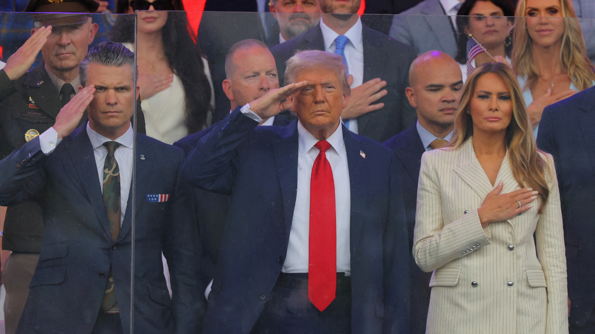 U.S. President Donald Trump, first lady Melania Trump and U.S. Secretary of Defense Pete Hegseth salute as they attend a military parade to commemorate the U.S. Army's 250th Birthday, on the day of U.S. President Donald Trump 79th birthday, in Washington, D.C., U.S., June 14, 2025. REUTERS/Carlos Barria TPX IMAGES OF THE DAY