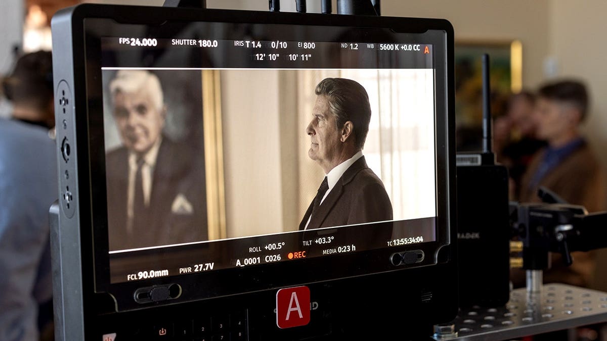 Jeff Daniels is seen on camera on a movie set.