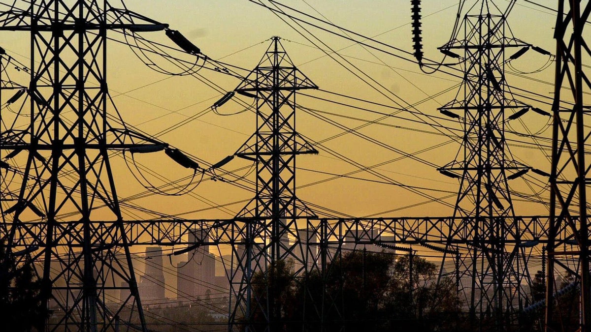 Power lines and a cityscape.