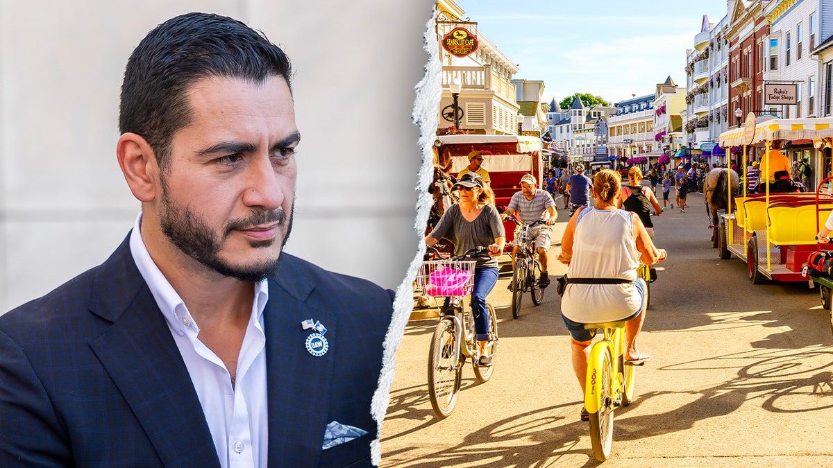 El-Sayed next to a photo of Mackinac Island