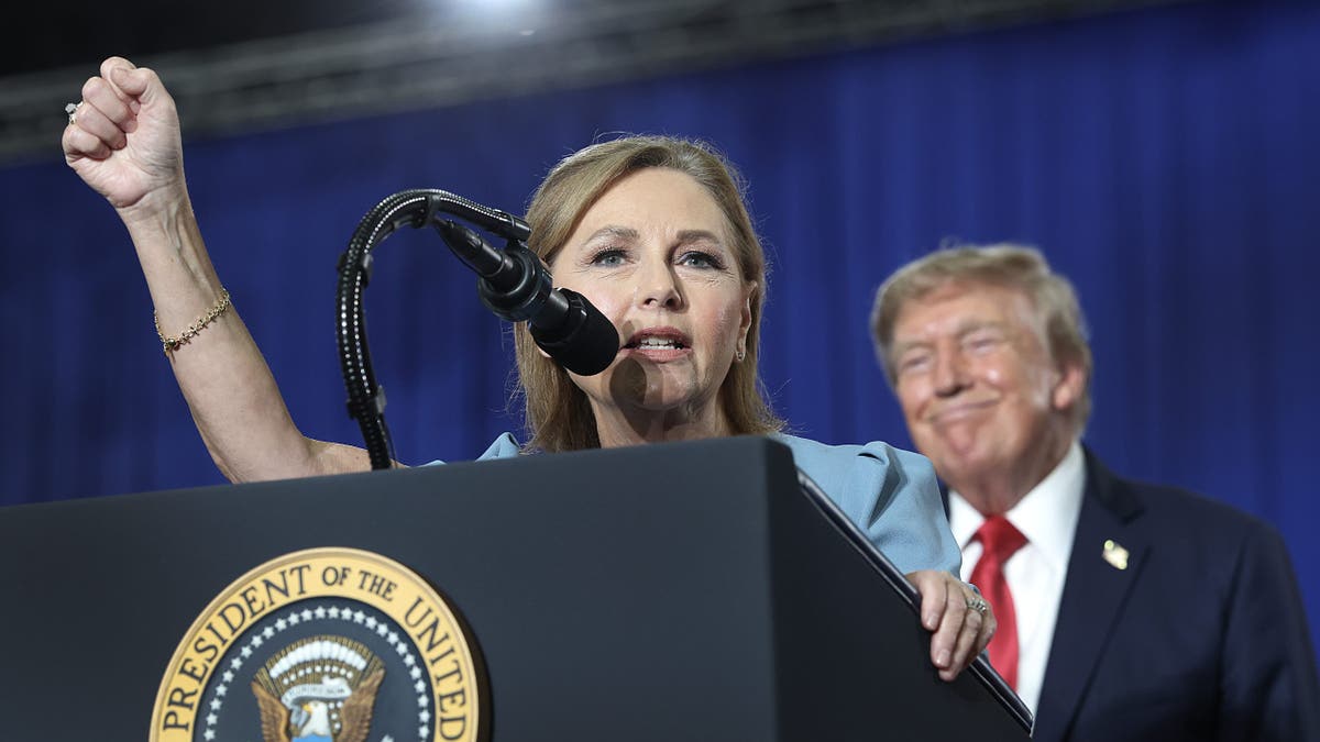 President Donald Trump listens to U.S. Sen. Darline Graham (R-SC) during a campaign rally on August 21, 2026 in Myrtle Beach, South Carolina. President Trump traveled to South Carolina to join Republican Senate candidate Darline Graham for a campaign rally ahead of Tuesday's runoff election against Ralph Norman.