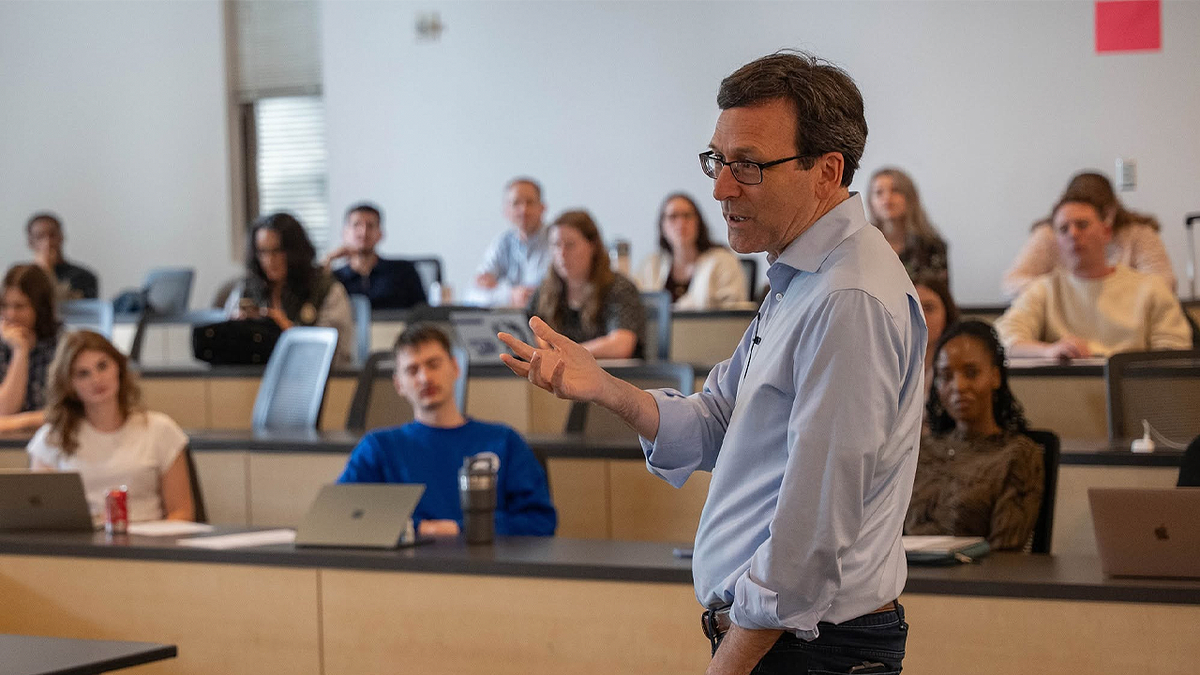 Washington Gov. Bob Ferguson speaks to students in a classroom