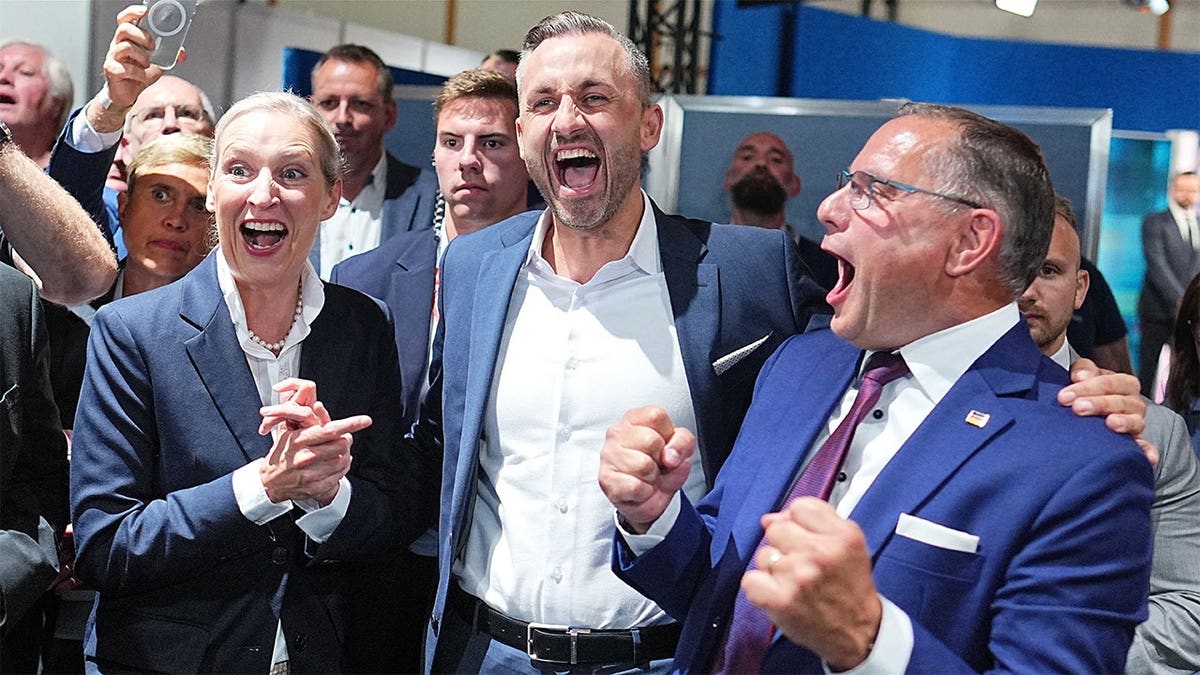 Ulrich Siegmund, center, lead candidate and co-chair of the AfD state parliamentary group in Saxony-Anhalt, celebrates with Alice Weidel, federal chairwoman and co-chair of the AfD parliamentary group in the Bundestag, and Tino Chrupalla, federal chairman and co-chair of the AfD parliamentary group in the Bundestag, after the first results at an election party of the 