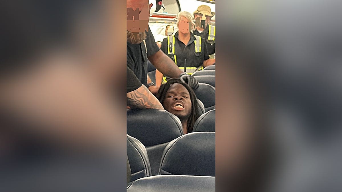 Wisteguens Jean Quely Charles on ICE deportation flight to Haiti