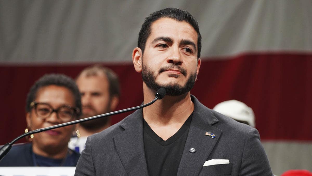 Dr. Abdul El-Sayed speaks at a podium during the Michigan Democratic Nominating Convention.
