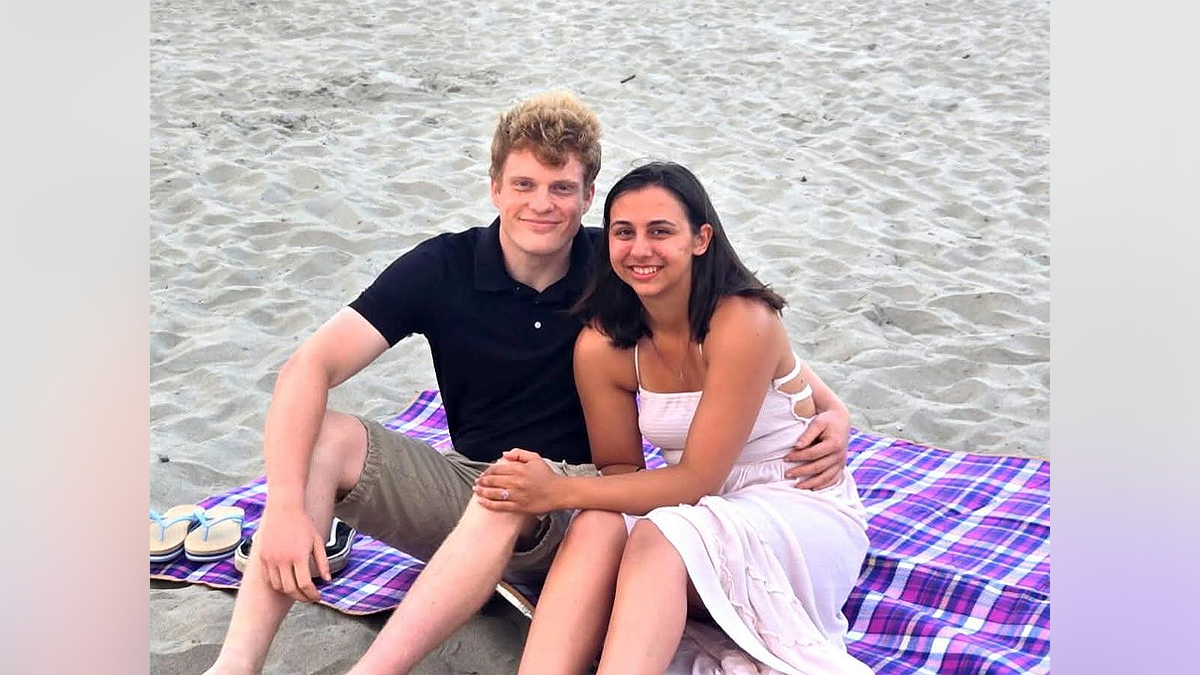 Cameron Lyon and his fiancée, Abrielle Kerns, sit together on a beach before the fatal Ohio crash