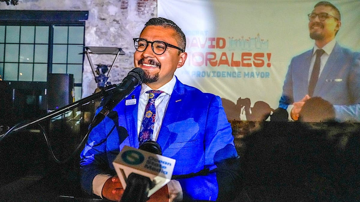 David Morales speaks at a podium during his acceptance speech at Riff Raff Bookstore.