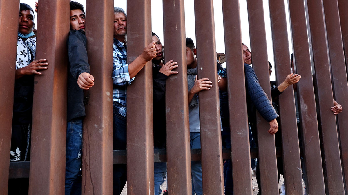 Migrants try to enter United States but stopped by border wall
