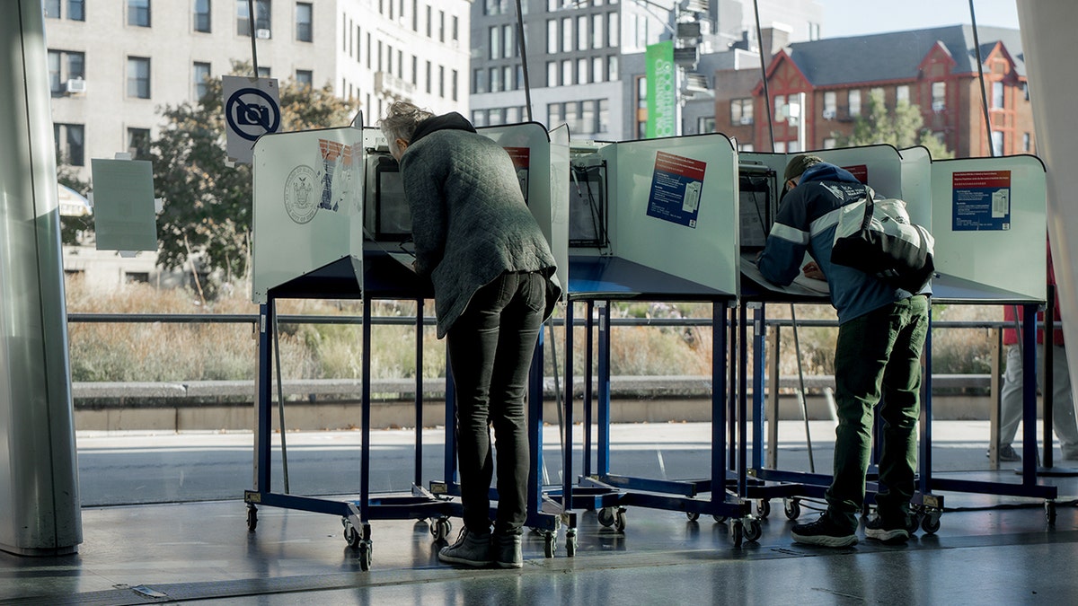 People cast their ballots during early voting on Saturday, Oct. 25, 2025, in New York.
