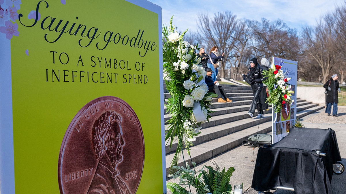 Signage at the memorial site of the "funeral for the penny," months after U.S. President Donald Trump's administration ordered the Treasury Department to halt production of the coins, at the Lincoln Memorial in Washington, D.C., U.S., December 20, 2025.