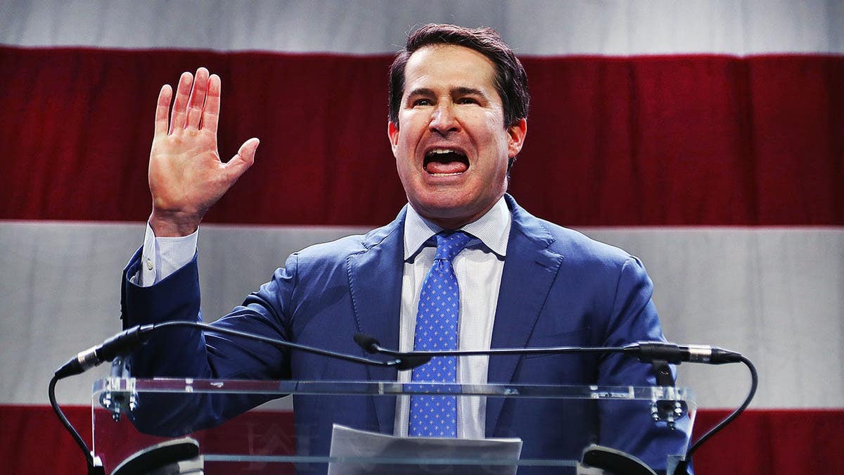 Rep. Seth Moulton speaks at a podium at the Massachusetts Democratic Party convention.
