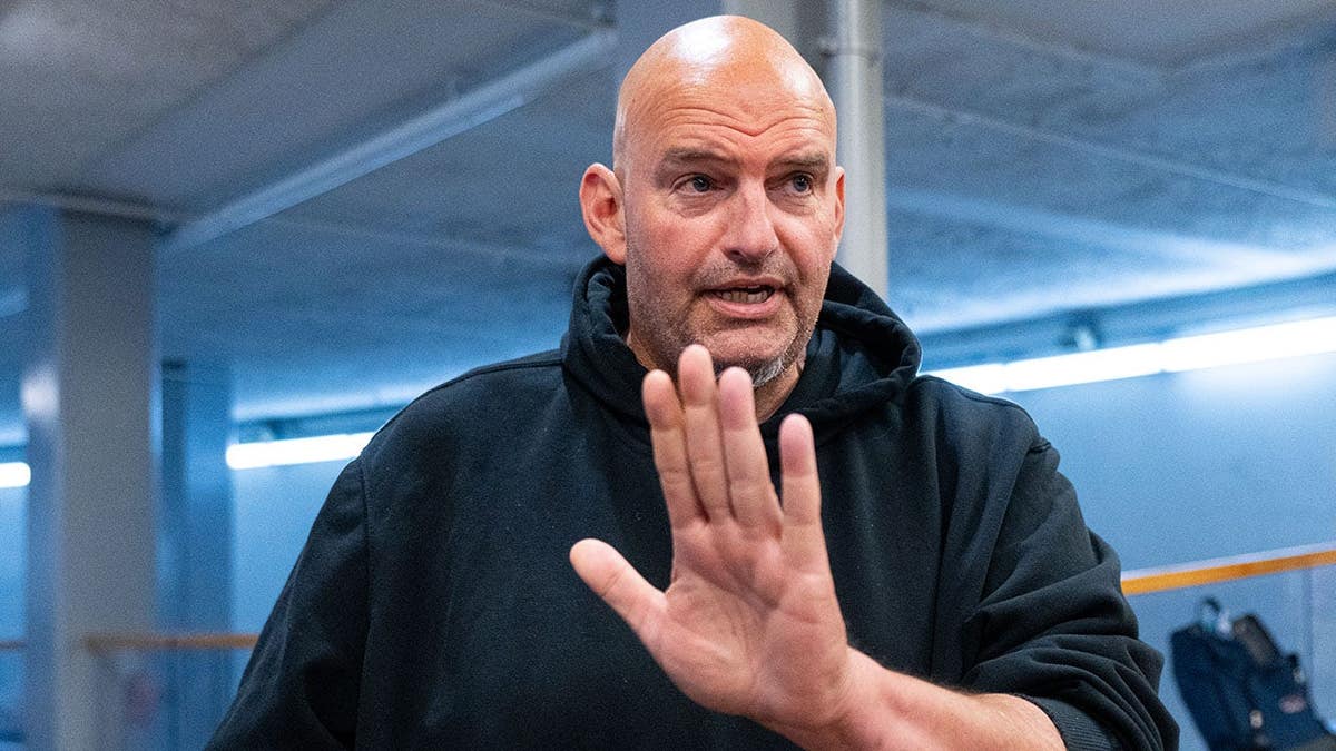 Sen. John Fetterman speaks to reporters at the U.S. Capitol.