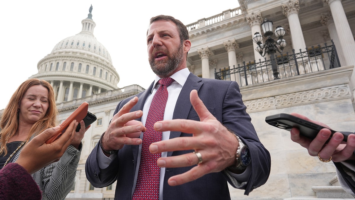 Sen. Markwayne Mullin speaking to reporters at the Capitol.