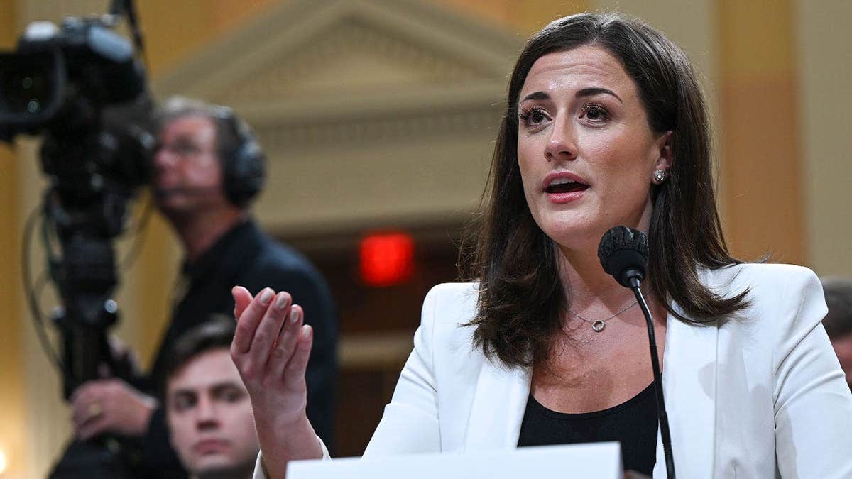 Cassidy Hutchinson gestures while speaking into a microphone during her Jan. 6 committee testimony