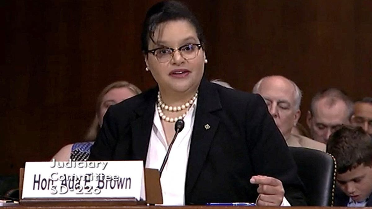 Ada Brown sits at a table during a Senate Judiciary Committee hearing.