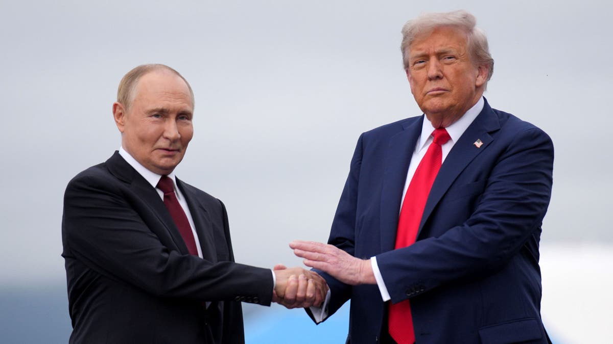 Russian President Vladimir Putin and U.S. President Donald Trump shake hands