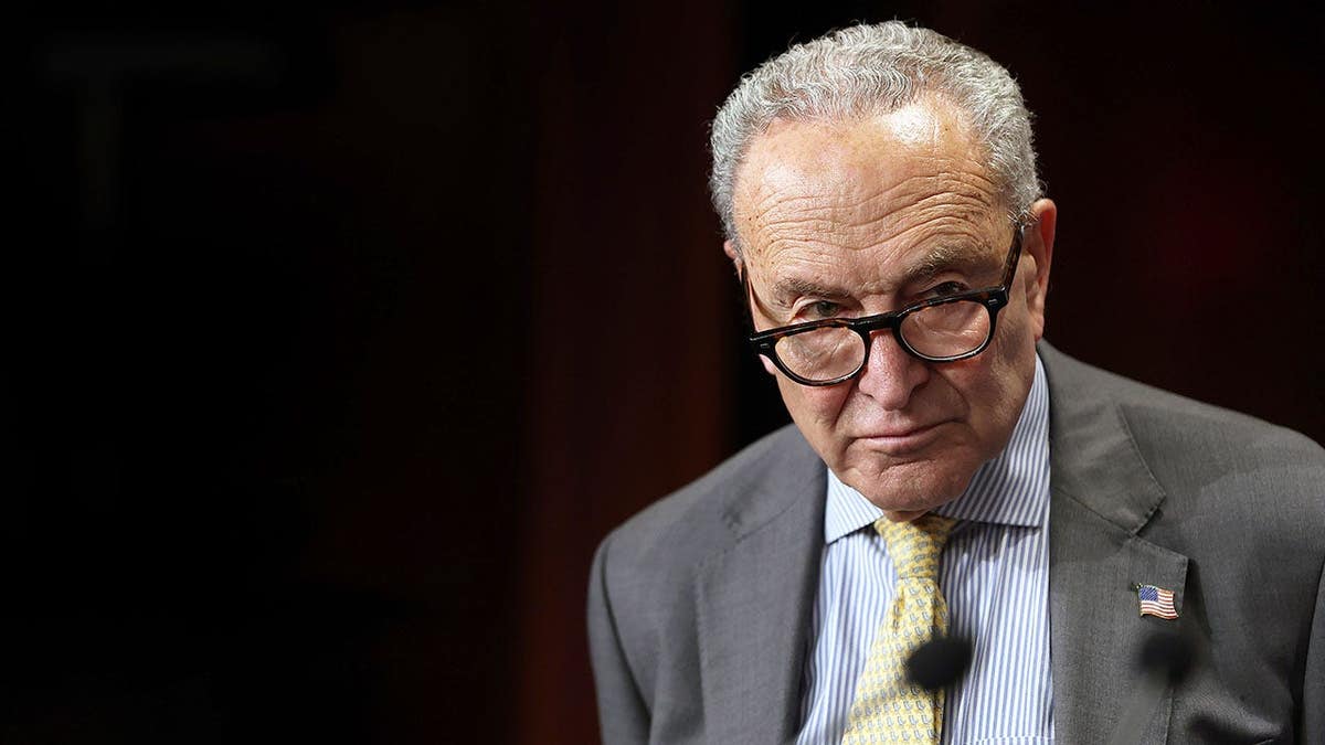 Chuck Schumer stands at a podium during a press conference at the U.S. Capitol.