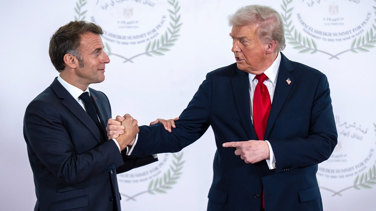 President Donald Trump shakes hands with France’s President Emmanuel Macron during a summit in Sharm El Sheikh.