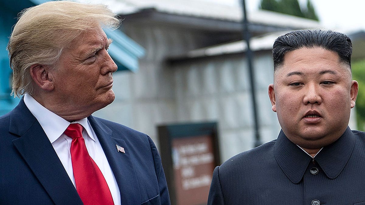 Donald Trump and Kim Jong-un talk before a meeting in the DMZ on June 30, 2019.