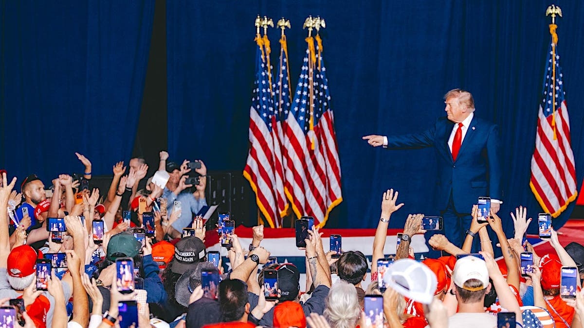 Donald Trump points at Ken Paxton's campaign event in San Antonio, Texas