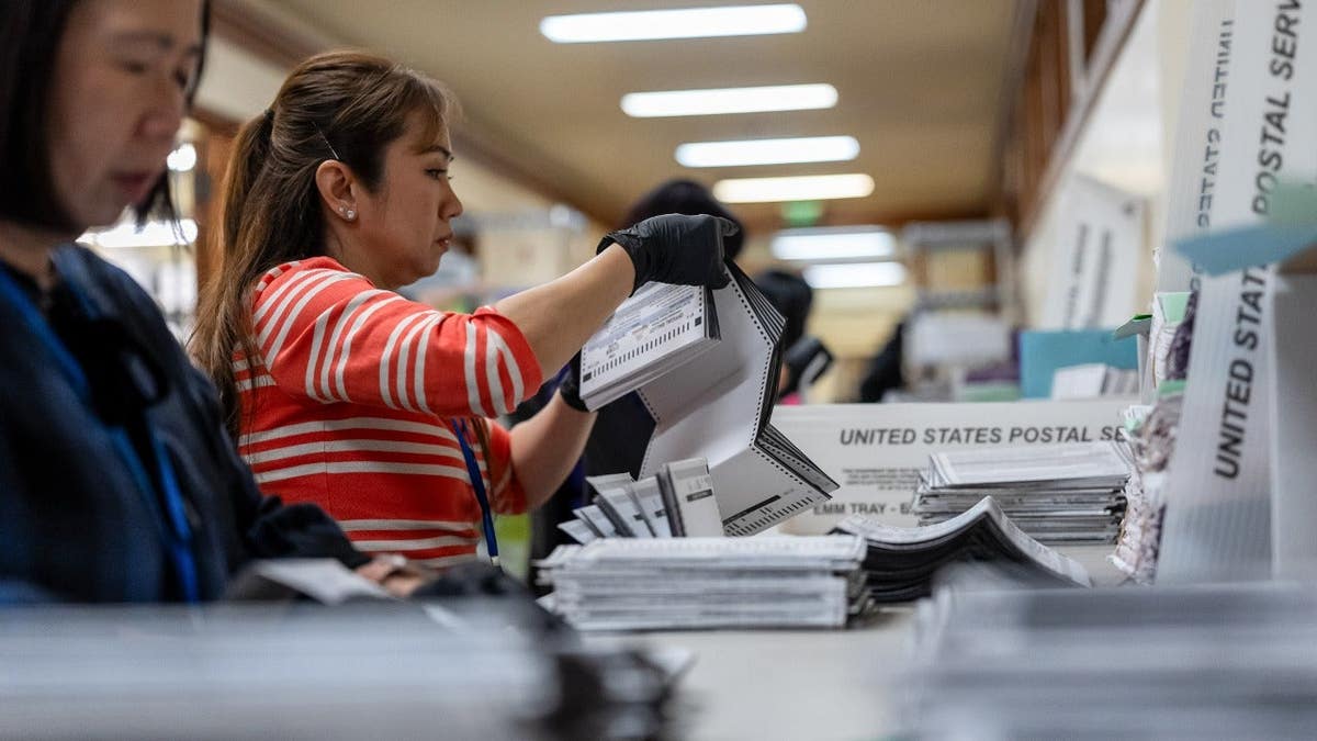 Election workers sort ballots in San Francisco on Oct. 21, 2026.