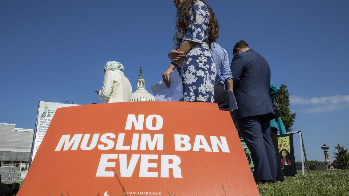 WASHINGTON, DC - JUNE 26: Activists protest on the anniversary of the Supreme Court's ruling upholding the Trump administration's restriction of travel to the U.S. from predominantly Muslin countries, on Capitol Hill June 26, 2019 in Washington, DC. The Court in a 5-4 ruling upheld a third version of the ban, which has also been applied to countries not predominantly Muslim. (Photo by Tasos Katopodis/Getty Images)