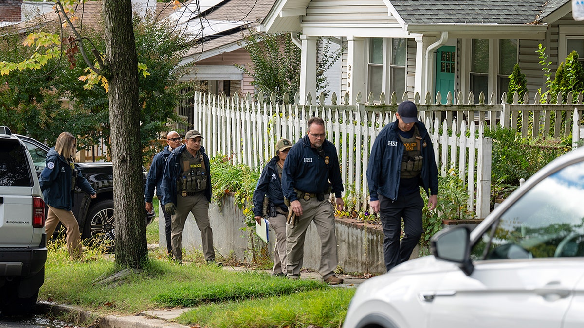 hsi-agents-walking-omar-house