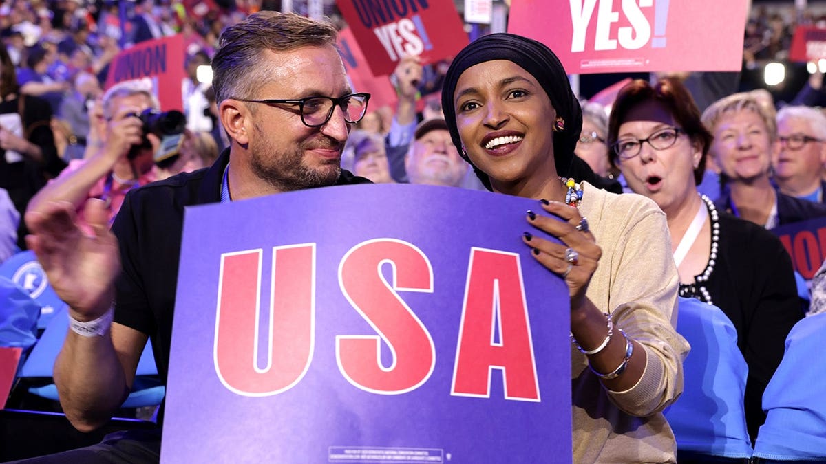 Tim Mynett and Ilhan Omar with USA sign