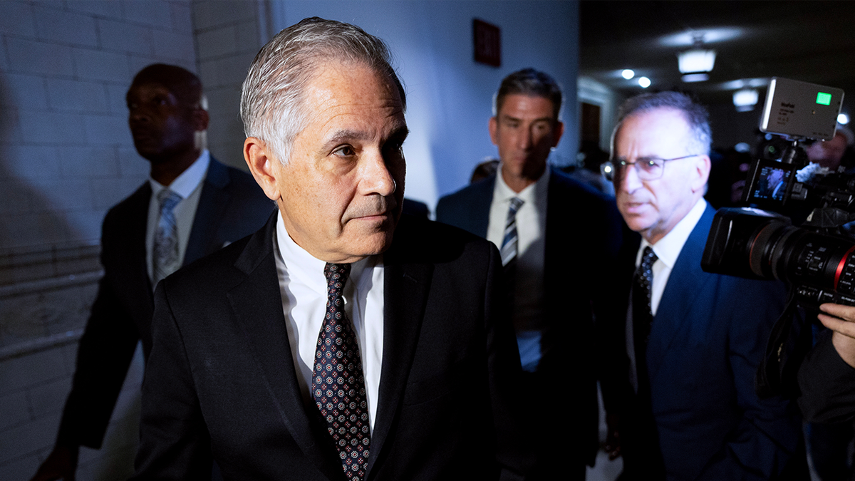 Larry Krasner, Philadelphia's district attorney, center, departs after a hearing at City Hall in Philadelphia, Pennsylvania, US.