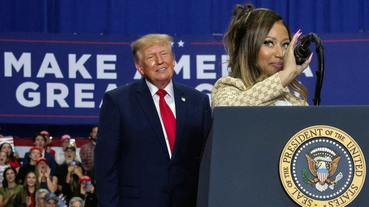 Recording artist Nicki Minaj and US President Donald Trump attend a rally