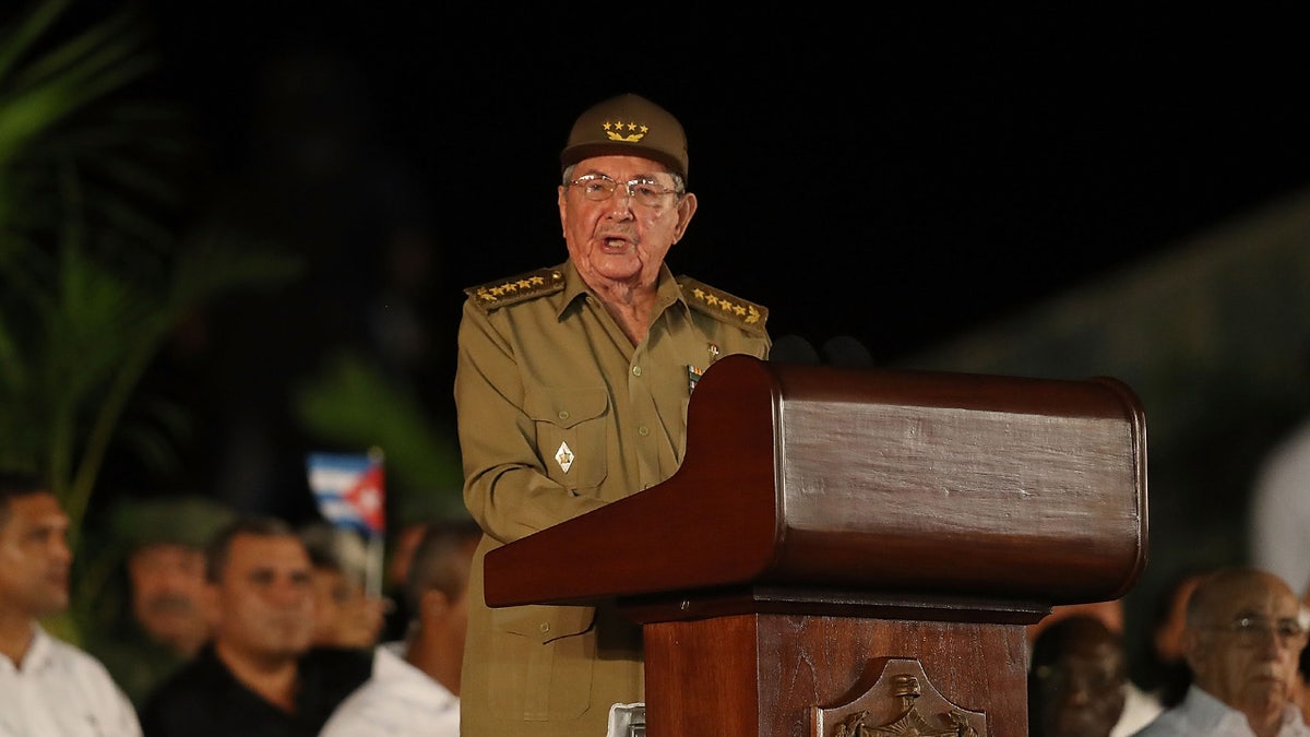 Raul Castro speaking at a podium