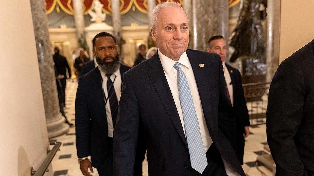 House Majority Leader Steve Scalise walks through the U.S. Capitol complex on his way to the House chamber ahead of a government funding vote.