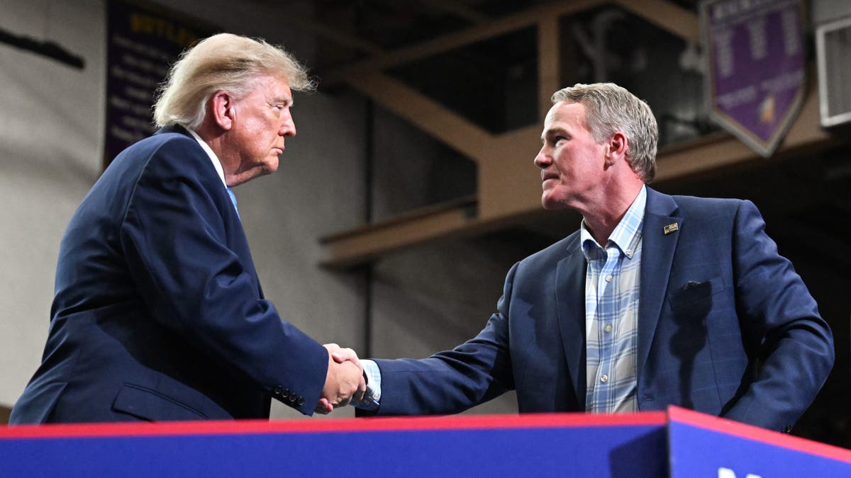 President Donald Trump shakes hands with Sen. Jon Husted