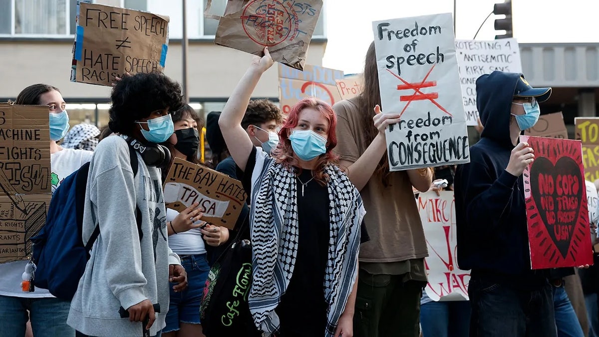 People protesting with signs