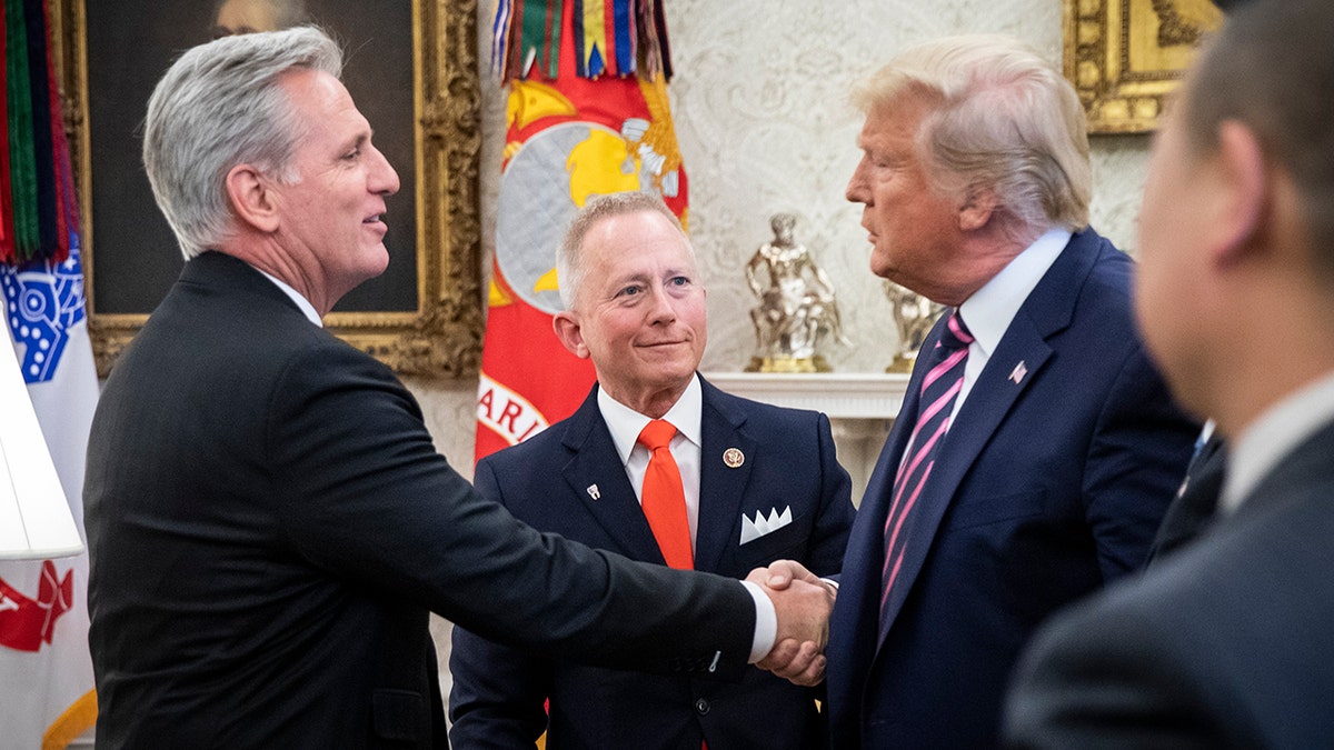 Kevin McCarthy shaking hands with Donald Trump