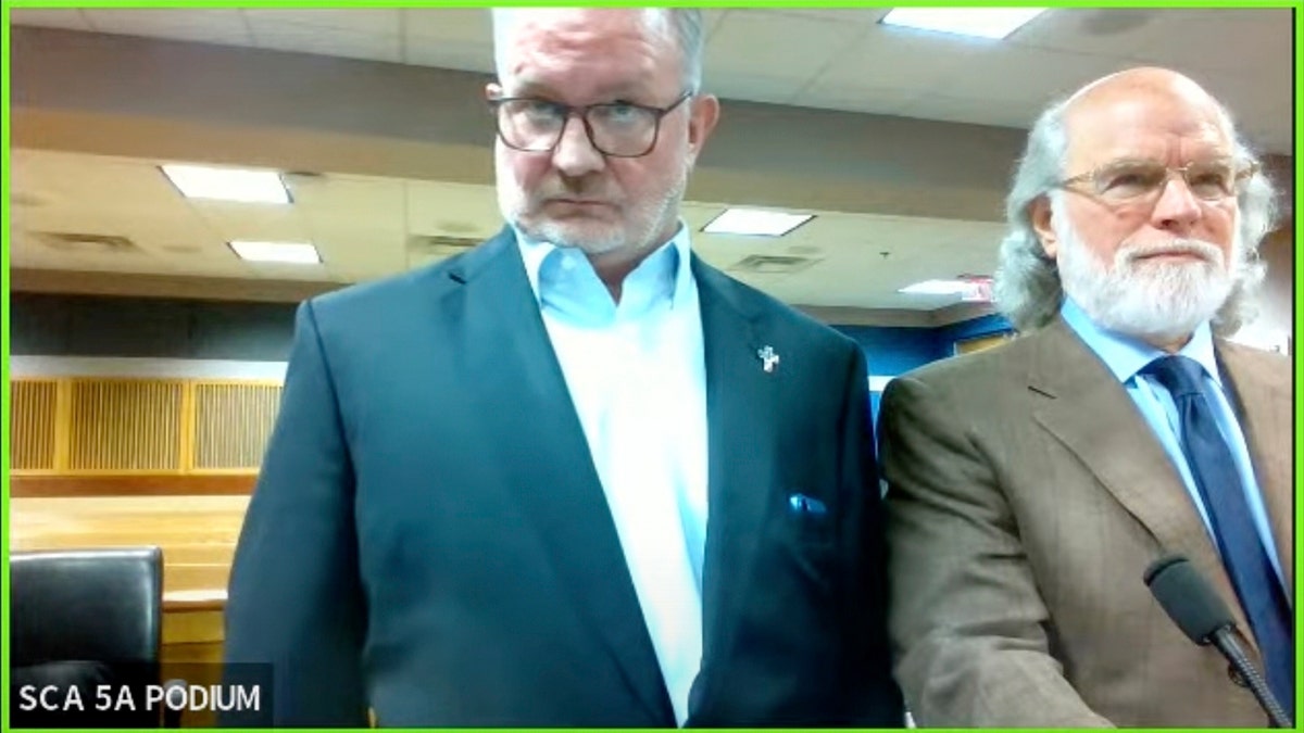 Screenshot of Judge Scott McAfee's virtual Zoom hearing showing Scott Hall, left, and his attorney Jeff Weiner
