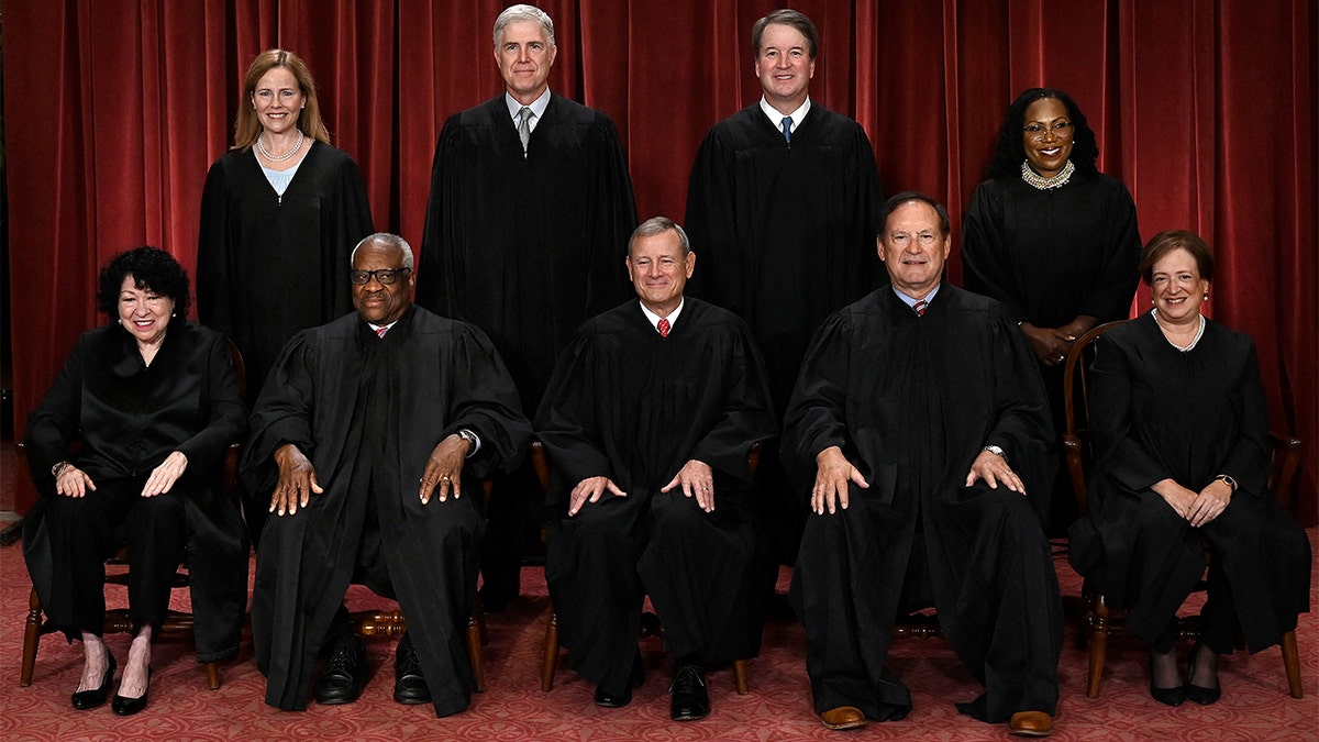 Supreme Court Justices sitting for a portrait.