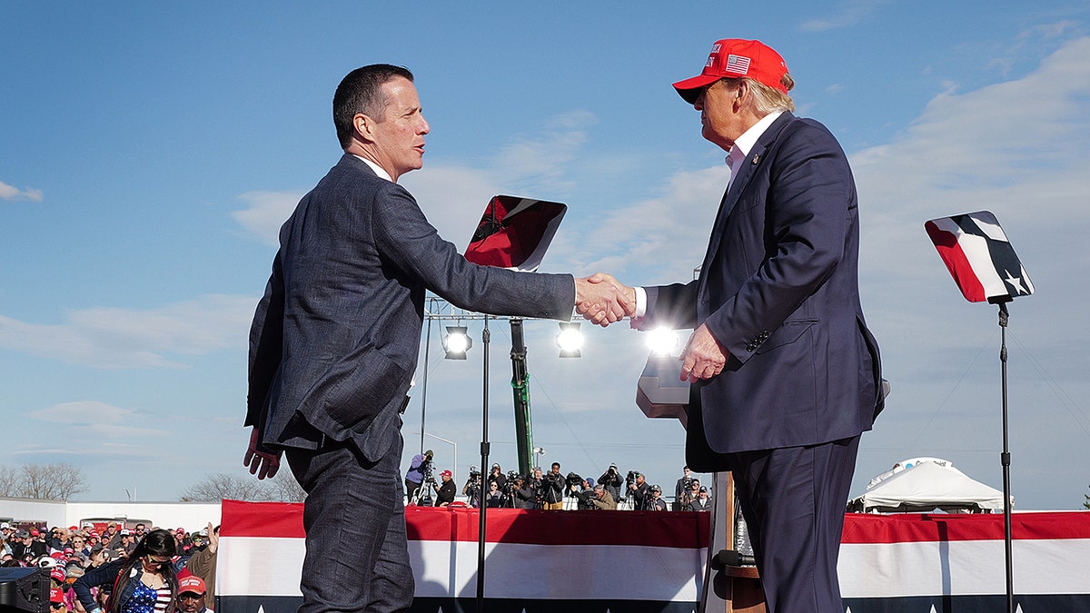Moreno, Trump shaking hands