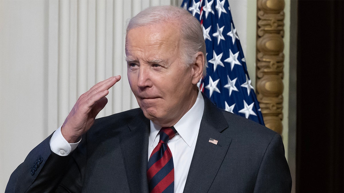 President Joe Biden salutes