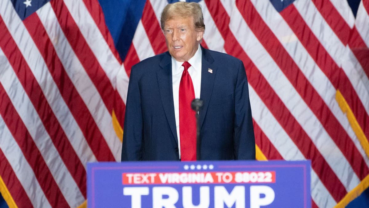 Donald Trump standing at podium