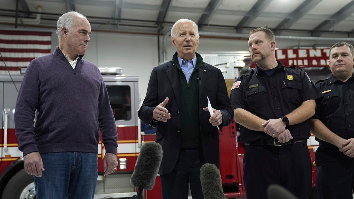 President Joe Biden at an Allentown, Pa. fire station with Sen. Casey, left